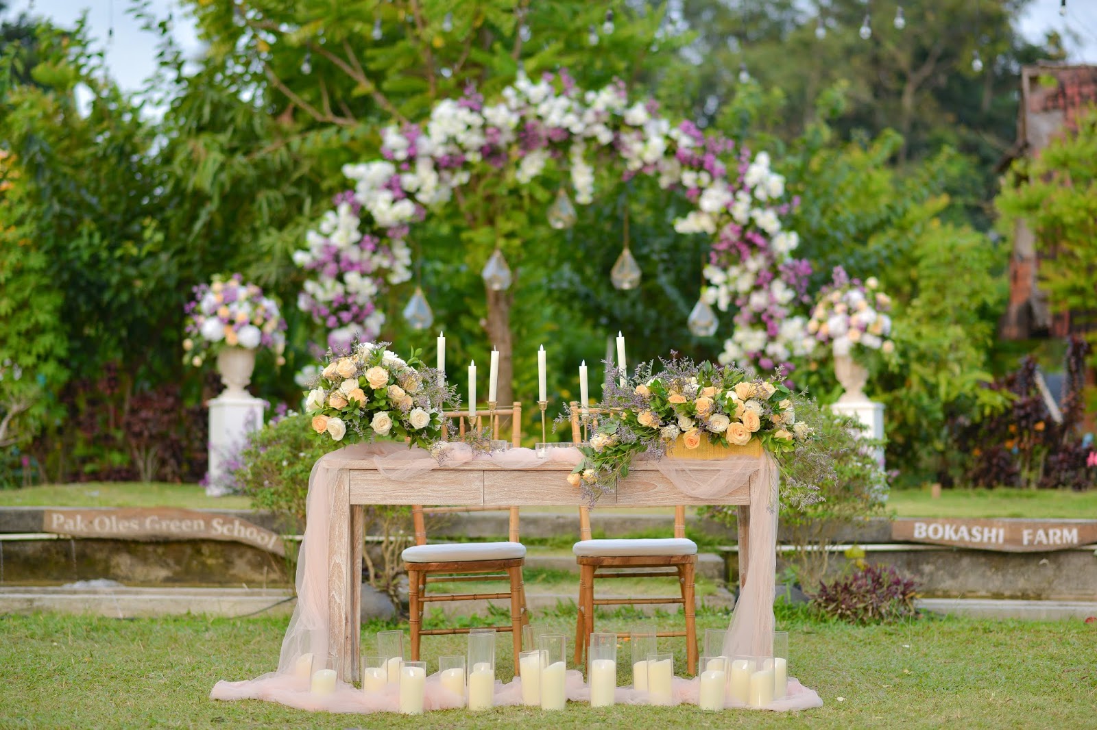 Round flower arch and registration table at Bokashi Farm